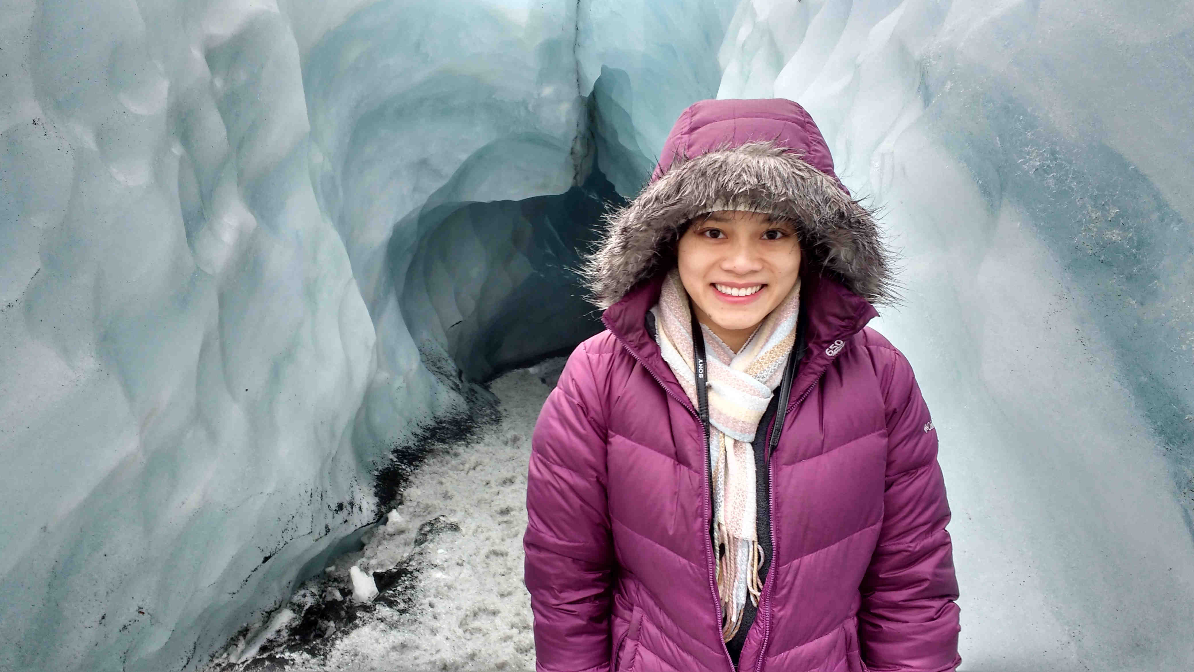 Hue in front of icecave in Iceland.